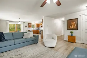 Another view of living room. Many recent updates include new laminated wood flooring and painted walls & trim.