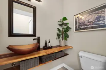 Main floor half bath with beautiful custom counter top.