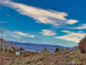Lake Roosevelt can be seen in the distance from bottom tier running along Pleasant Valley Rd where an easy in RV/camper trailer parking area is located