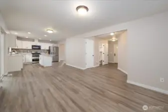 Main house: Living room, kitchen, and powder room on main floor.