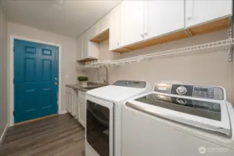 Main house: Utility room off garage on main floor.