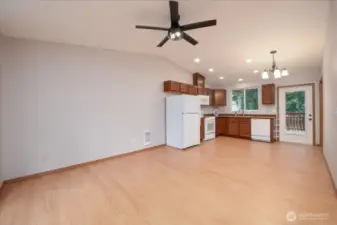 DADU: Living room, kitchen, and access to cover back deck with ramp.