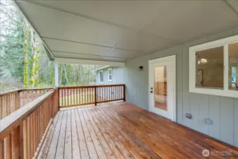 DADU: Covered deck off of kitchen with ramp access to back yard.