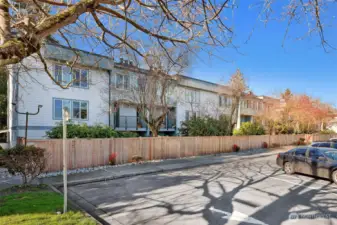 There are several parking spaces in the front of the building to park.  It is owned by the city and there are no permit or time restrictions to park there.  It's great for guest parking.