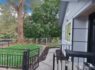 Private front walkway surrounded by greenery — peaceful, clean, and freshly updated. Step inside and feel the calm right from the front gate.