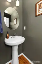 Main floor bathroom updated with new luxury vinyl plank flooring for durability and modern appeal.