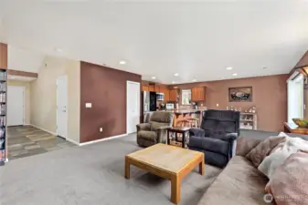 Spacious living area flows easily into dining and kitchen spaces, creating an open-concept feel for everyday living.