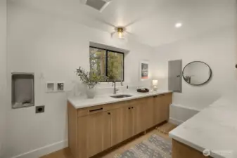 Large laundry room with washer/dryer hook-ups.