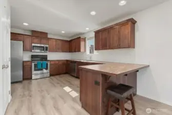 Kitchen with small eating bar.