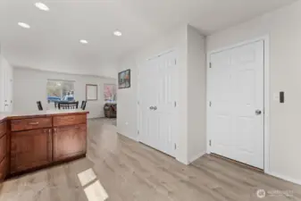 From the kitchen and looking towards the dining room. Door to the garage is to the right.