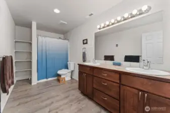 Generous sized primary bathroom with double sinks & vanities.