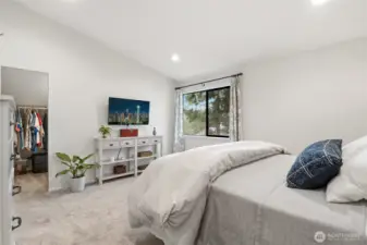 Primary features vaulted ceilings, and two walk in closets