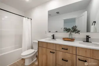 Photos shown are of a similar floor plan previously built in a different neighborhood (The Ridge in Blaine). Finishes and features may vary. Some items pictured reflect buyer-selected upgrades which are not included in the base price and may be added at an additional cost.