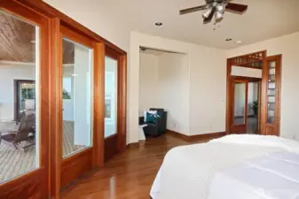 Primary with access to the deck and sitting area