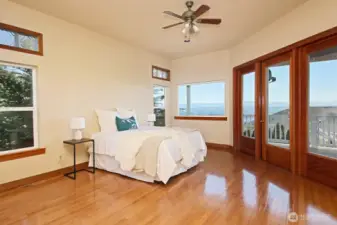 Large primary bedroom with views of Hat Island and Mt Baker