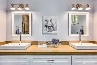 Dual sinks, contemporary design, and lots of storage space make this a bathroom you will love!