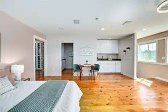 This above-garage suite has a small kitchenette, a private 3/4 bath, and a huge closet system with room for a desk if desired.