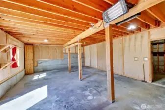 Beneath the garage is a partially finished space that is waiting for you to define it. Exercise room? Play room? Crafts and hobbies? What will you do with this space? Note it is wired for a generator, as well.