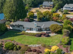 This exceptional property is a rare gem, nestled on a beautifully landscaped 0.63-acre lot, artfully designed by a local landscape designer.