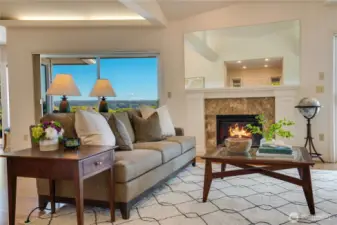 The elegant gas fireplace serves as a warm, inviting anchor for the living room.