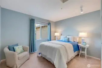 A second bedroom and full bath provide an ideal setup for guests or family, offering comfort and privacy away from the main-level suite.