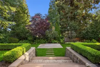 In the backyard, steps down to the huge & level back lawn.