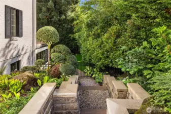 There is a neat gravel pathway around the side of the home leading to the lower level.