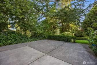 This patio is on the other side of the home (from the gravel pathway).  It would be a fun spot for a basketball hoop, rolerskating, 4-square or whatever!