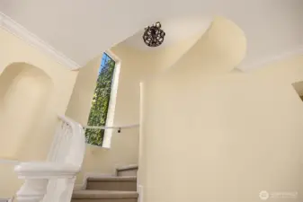Front hall stairs leading to the second floor.