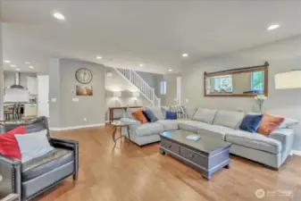 Second view of the living room looking back towards the front door and stairs.