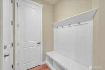 Built in bench & coat rack leading from garage through kitchen.  Large walk-in pantry to the left.