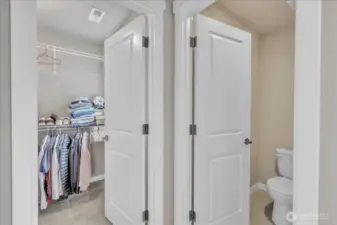 Large primary walk-in closet and private water closet.