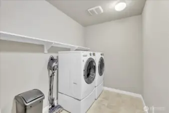 You will love the convenience of the upstairs laundry room!
