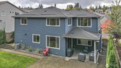 Drone photo showcasing  covered patio.
