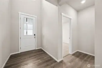 Inviting Entry with Glass in the door for added light.  This also shows the Downstairs Bedroom.