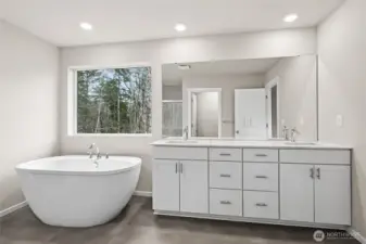 Primary Bath featuring Double Vanity, Two Banks of Drawers, and Freestanding Tub.