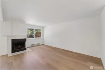 Spacious and light-filled living room w/ fireplace