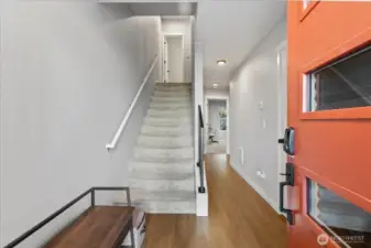 Enter on the lower floor where you'll find a large bedroom with greenbelt views & it's own en-suite.