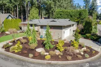 Professionally landscaped with outdoor lighting, this house commands attention and is ripe for those looking to entertain others in style!