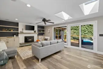 The newer Milgard windows create that seemless transition from inside to outside! A wood fireplace insert for those blustery, cooler days awaits when desired! Custom cabinetry and surround sound throughout!