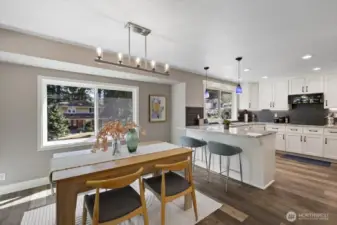 Modern lighting in this larger kitchen eating area, informal dining room!  The kitchen was opened up for that nice "flow" through feel.