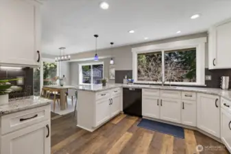 Such a nice open kitchen with plenty of room to operate! Custom cabinetry throughout! Lazy Susans in the corner, pull-outs throughout the lower level cabinetry.  Soft close cabinets!