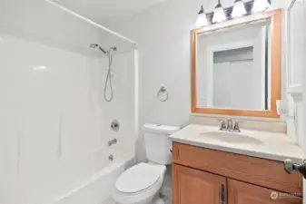 A full bathroom is conveniently located off the hallway.