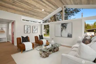 Open concept living room with large custom windows with Mt Si views