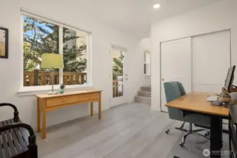 A lovely inviting space is perfectly suited for an office. Not pictured, but next to the desk is the door from the garage.  Note: this photo is from a previous listing and used with permission of photogrpaher.