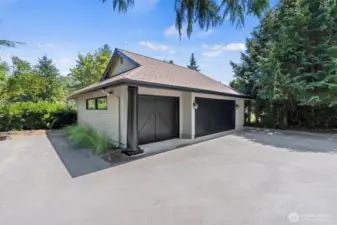 The oversized 737-square-foot, three-car garage offers ample space for vehicles, tools, and gear. With a drop-down ladder to attic storage and plumbing access for water, it’s well-equipped and versatile—offering excellent potential for a workshop or hobby space.