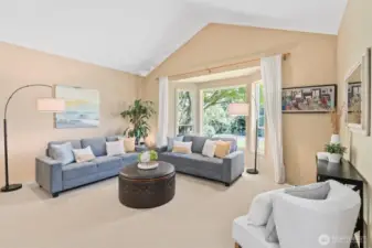 The formal living room with vaulted ceilings offers a peaceful setting for relaxing or entertaining. Versatile in function, it’s ideal for music, conversation, quiet reading, or even a cozy home library.