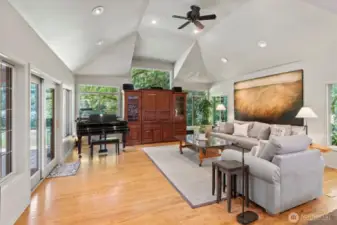 The spacious inviting family room perfectly balances cozy comfort with modern style. The soaring vaulted ceilings, and thoughtfully designed details create an ideal space for relaxing, lively family evenings and entertaining guests.