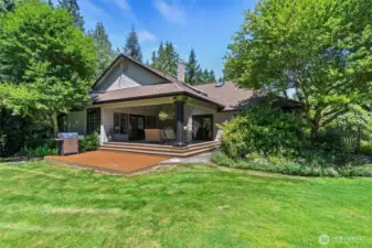 This private outdoor retreat is a lovely spot to admire the beautifully maintained property, lush greenery, and the changing seasons. Whether you're enjoying spring blooms, soaking up summer sunshine, taking in vibrant fall colors, or watching a quiet dusting of snow in winter, this space brings the beauty of nature into everyday life.
