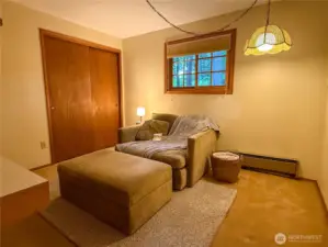 3rd bedroom staged as a cozy reading room